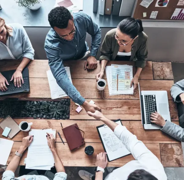 good-job-top-view-young-modern-men-smart-casual-wear-shaking-hands-working-creative-office-131402912